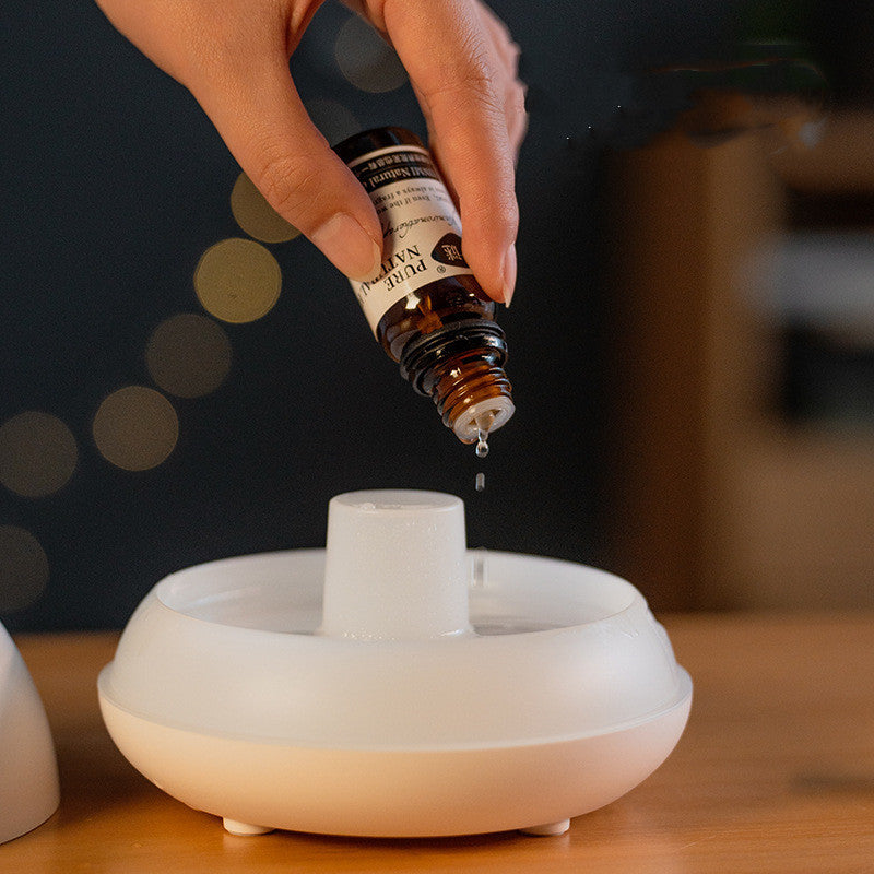 Diffuseur humidificateur FlamAroma flamme effet lumière LED USB portable compact silencieux aromathérapie huiles essentielles zen ambiance relaxation décoration moderne brume vapeur maison bureau chambre salon apaisant calme
